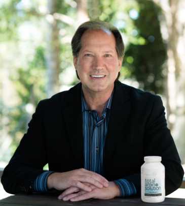 Dr. Daniel Smith, D.C., showcasing vegan, free form amino acid supplements.